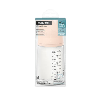 Se muestra un Biberón Anticólicos ZERO ZERO de Suavinex con tapa de color melocotón, perfecto para padres de Mallorca que buscan productos con entrega a domicilio allí. Tiene una capacidad de 270 ml (9 onzas líquidas estadounidenses), tiene marcas de medición y es ideal para bebés de 3 meses en adelante. El envase destaca su diseño de silicona ultra suave.