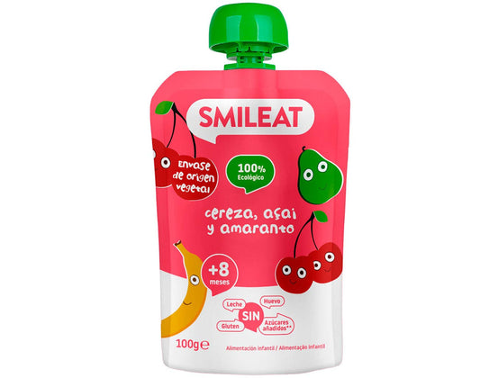 Bolsa de papilla Smileat con diseño rojo con ilustraciones de cerezas y plátanos, etiquetada como 100% ecológico y sin leche, sin huevo. Ideal para quienes buscan productos ecológicos de calidad para bebés en Mallorca. Nombre del producto: Smileat - Pouch de Cereza, Açai y Amaranto.